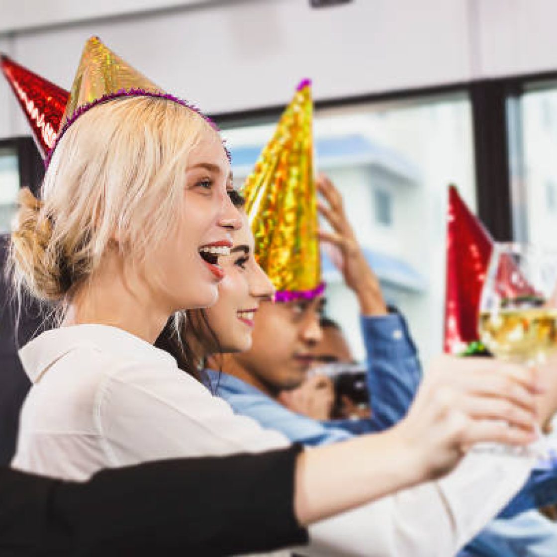 Business people of successful with drinking champagne, talking and smiling while celebrating in office