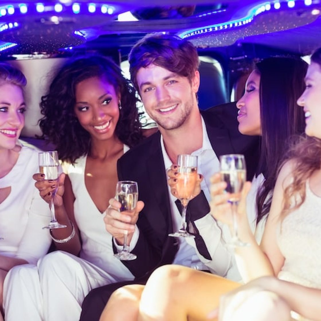 happy-friends-drinking-champagne_107420-27678